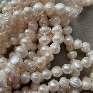THREE STRANDS OF GENUINE FRESHWATER LUSTROUS PEARLS